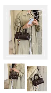Chic brown leather shoulder bag for women, stylish crossbody handbag with belt and charm.
