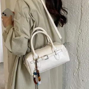 Fashion small handbag crossbody bag for women stylish shoulder bag with beaded pendant.