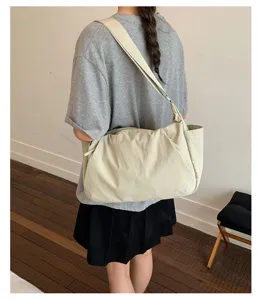 Large capacity nylon crossbody bag for women, solid color casual shoulder tote for daily commute.