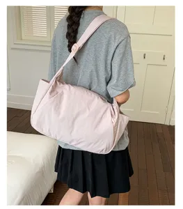 Casual pink nylon crossbody bag for women, large capacity commuter tote shoulder bag.