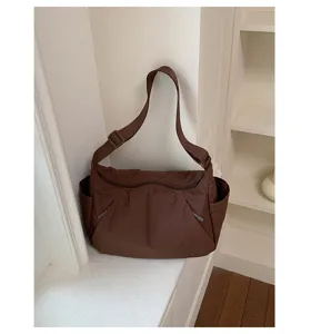 Large capacity solid nylon shoulder bag for women commuter casual daily crossbody use.