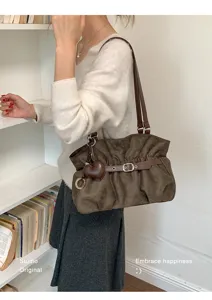 Korean retro pleated shoulder bag for women, minimalist brown handbag with heart pendant.