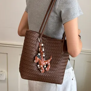 Brown woven leather tote bag for women, large capacity shoulder bag with cute dog charm.