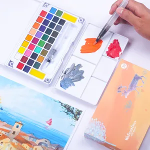 Set de pintura de acuarela sólida portátil de 36 colores con pincel de agua y paleta artística.