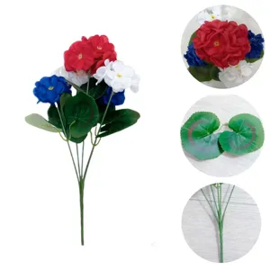 Artificial geranium flower bouquet detail, red white blue flowers with green leaves for decor.