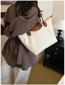 Large capacity nylon tote bag with brown leather flap, casual shoulder travel handbag for women.