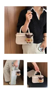 Detail view of retro brushed women handbag featuring a cute knit bear pendant charm stylish.