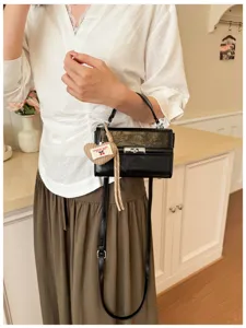 Retro mini handbag for women, stylish vintage square shoulder crossbody commuter bag.