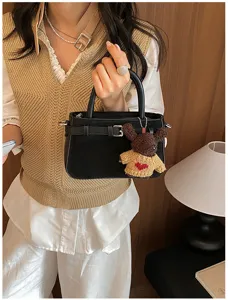 Retro women handbag with cute knitted bear pendant, stylish black shoulder commuting bag.