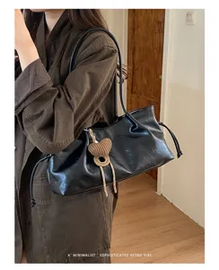 Stylish black slouchy shoulder bag for women, retro large capacity hobo tote for daily commute.