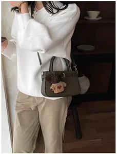 Vintage brushed women crossbody handbag with cute bear charm for stylish daily commuting wear.