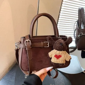 Vintage brown women shoulder bag with cute bear pendant, stylish commuter handbag for daily use.