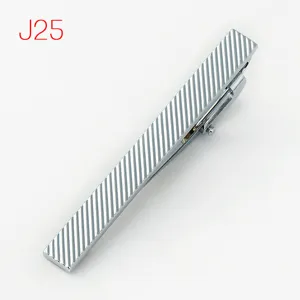 Silver metal tie clip detail view, geometric ribbed stripe design, elegant men accessory.