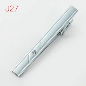 Silver metal tie clip detail shot featuring elegant rhinestone and modern geometric lines.