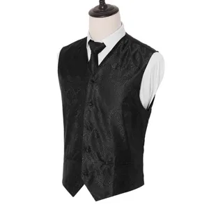 Close-up view of men's black paisley jacquard waistcoat and matching tie set detail.