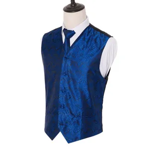 Detail view of men's blue paisley jacquard vest and tie set, slim fit style for wedding party.