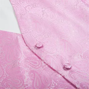 Close-up of pink paisley jacquard vest fabric showing detailed texture and covered button.