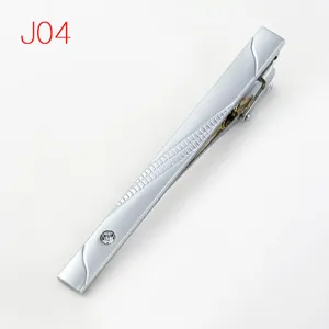 Men's silver tie clip with geometric texture and crystal accent, formal fashion jewelry.