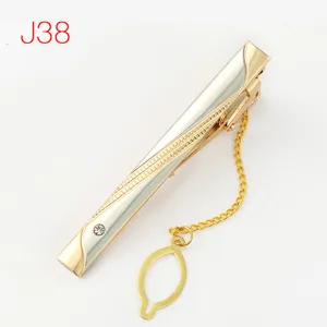 Detail shot of gold silver men tie clip geometric pattern luxury business suit accessory.