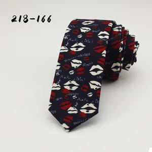 Retro cotton printed necktie detail, stylish dark blue slim tie with red and white lip patterns.