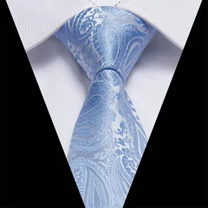 Detail view of a classic light blue paisley jacquard silk necktie for men wedding party.
