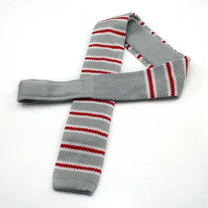 Men's knitted tie featuring grey and red striped design, stylish and versatile flat-end style.