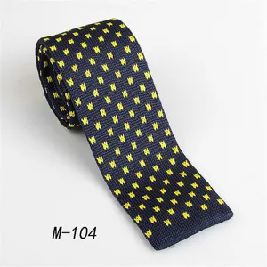 Men's navy blue knitted tie with yellow geometric pattern, stylish casual flat-end necktie.