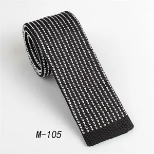 Classic black and white knit tie for men, stylish flat-end design for business and casual wear.