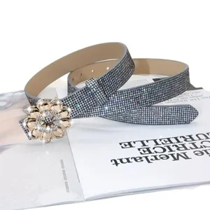 Close-up detail of luxury rhinestone flower buckle belt sparkling crystals design