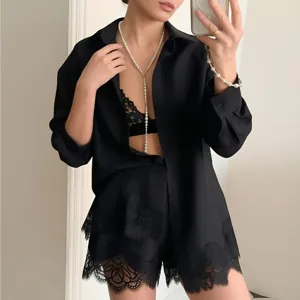 Black silk shirt and lace shorts set detail, elegant minimalist summer fashion outfit.
