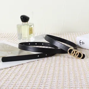 Women thin black leather belt detail featuring gold interlocking rings minimalist fashion style