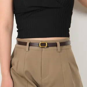 Women thin leather belt with vintage square buckle, versatile minimalist dress accessory.