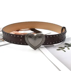 Brown leather belt featuring a vintage metal heart buckle and stylish studs for daily wear.