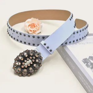 Light blue leather waist belt featuring rhinestone floral buckle and stylish metal rivets detail.