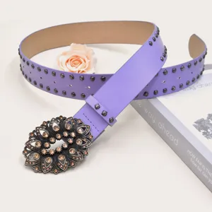 Purple leather decorative belt with rhinestone flower buckle and metal studs for women.