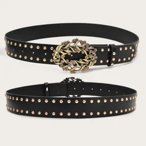 Exquisite vintage rhinestone studded black belt for women, featuring a detailed ornate floral buckle.