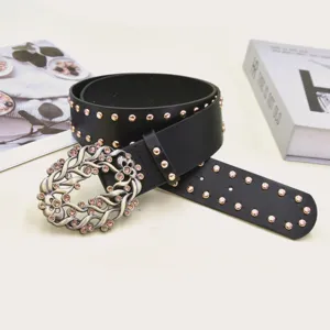 Women vintage black leather belt with gold studs and ornate rhinestone buckle for dresses.