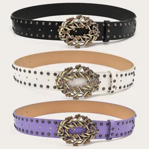 Rhinestone floral buckle waist belt with metal studs, elegant women clothing accessory.