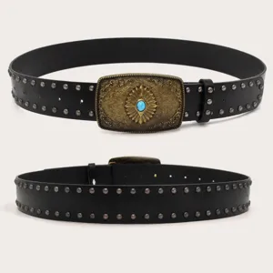 Detailed close-up view of a black leather belt with metal studs and vintage brass buckle.