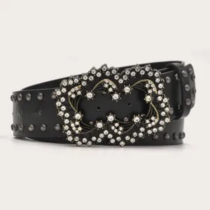 Detailed view of a stylish black leather rhinestone studded punk belt with sparkling crystal buckle.