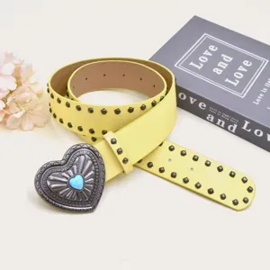 Vintage yellow rivet leather belt with heart metal buckle, punk style Y2K fashion accessory.