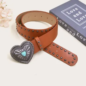 Vintage brown leather belt for women with metal studs and a statement heart buckle for Y2K.