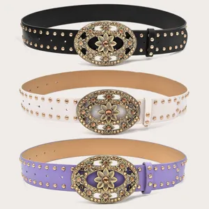 Vintage rhinestone floral buckle studded belt detail, elegant women's waist accessory.