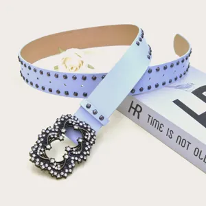 Light blue punk style studded leather belt with rhinestone metal buckle for women denim jeans.