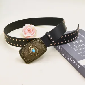 Vintage European style wide leather belt with ornate metal buckle and chic rivets accessory.
