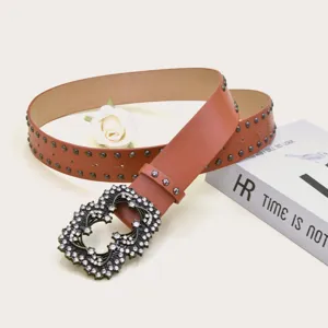 Brown leather studded belt for women with vintage rhinestone buckle, chic punk style detail.