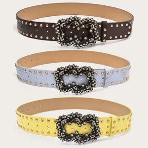 Trendy rhinestone buckle wide belt with metal studs, stylish women decorative waist belt detail.