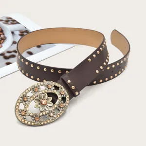 Detailed view of the vintage brown leather belt featuring an ornate floral rhinestone buckle.