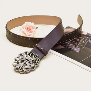 Vintage Y2K punk wide leather belt with rivet studs and ornate butterfly metal buckle for women.