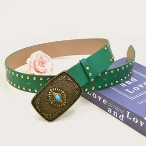 Vintage green wide leather belt detailed with golden metal studs and ornate gemstone buckle.